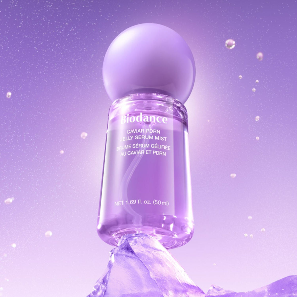 Biodance serum mist bottle on a purple background with bubbles