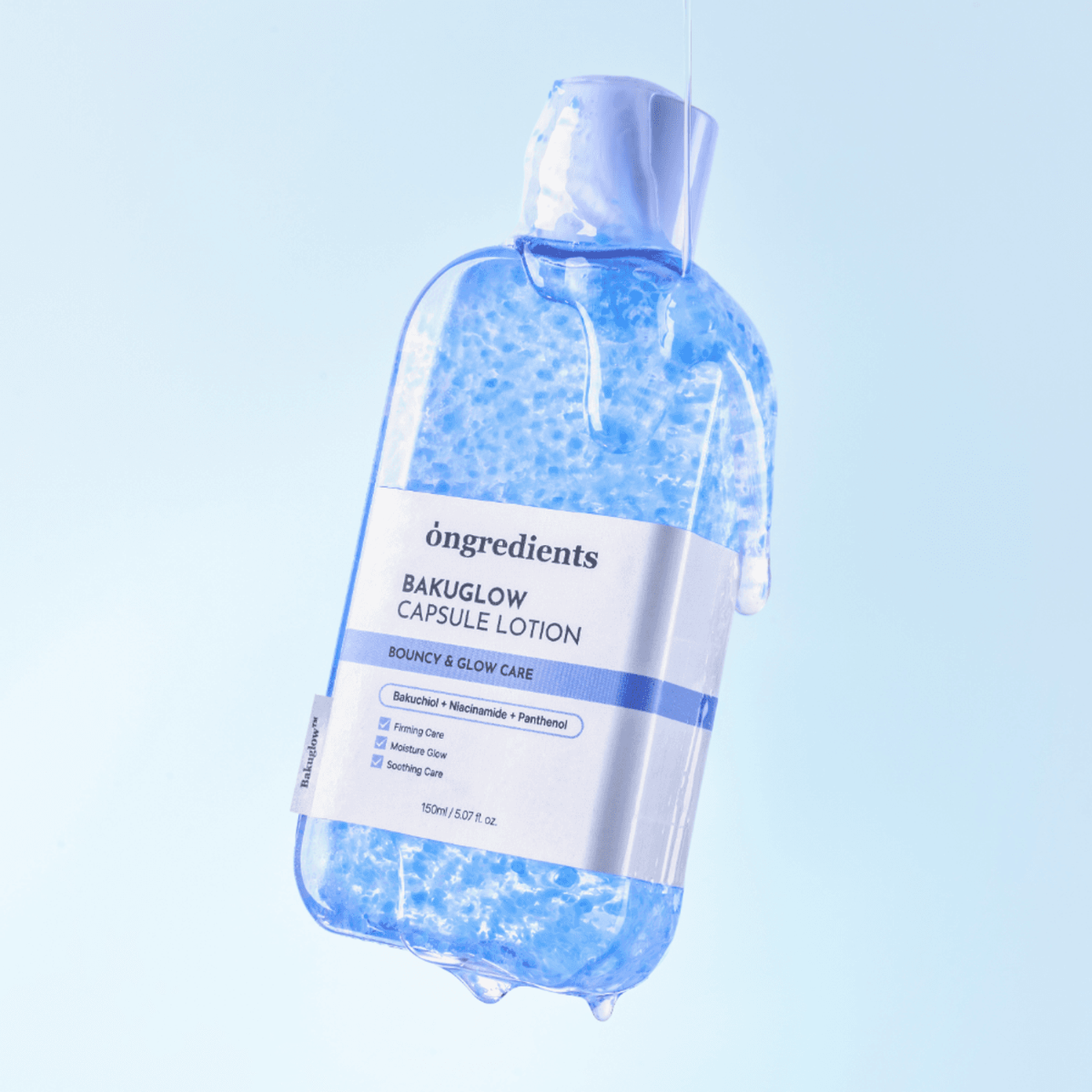 A clear plastic bottle of öngredients BakuGlow Capsule Lotion filled with translucent blue gel, shown floating against a light blue gradient background with a dripping effect at the base.