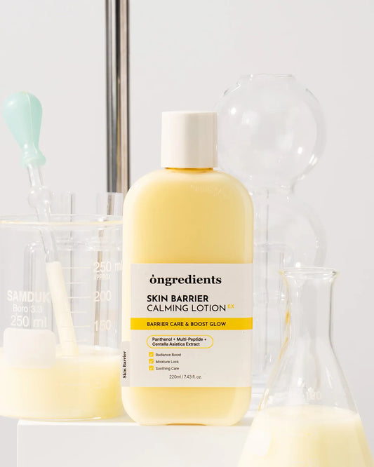 Bottle of 'ongredients Skin Barrier Calming Lotion' with a white label on a blurred background.