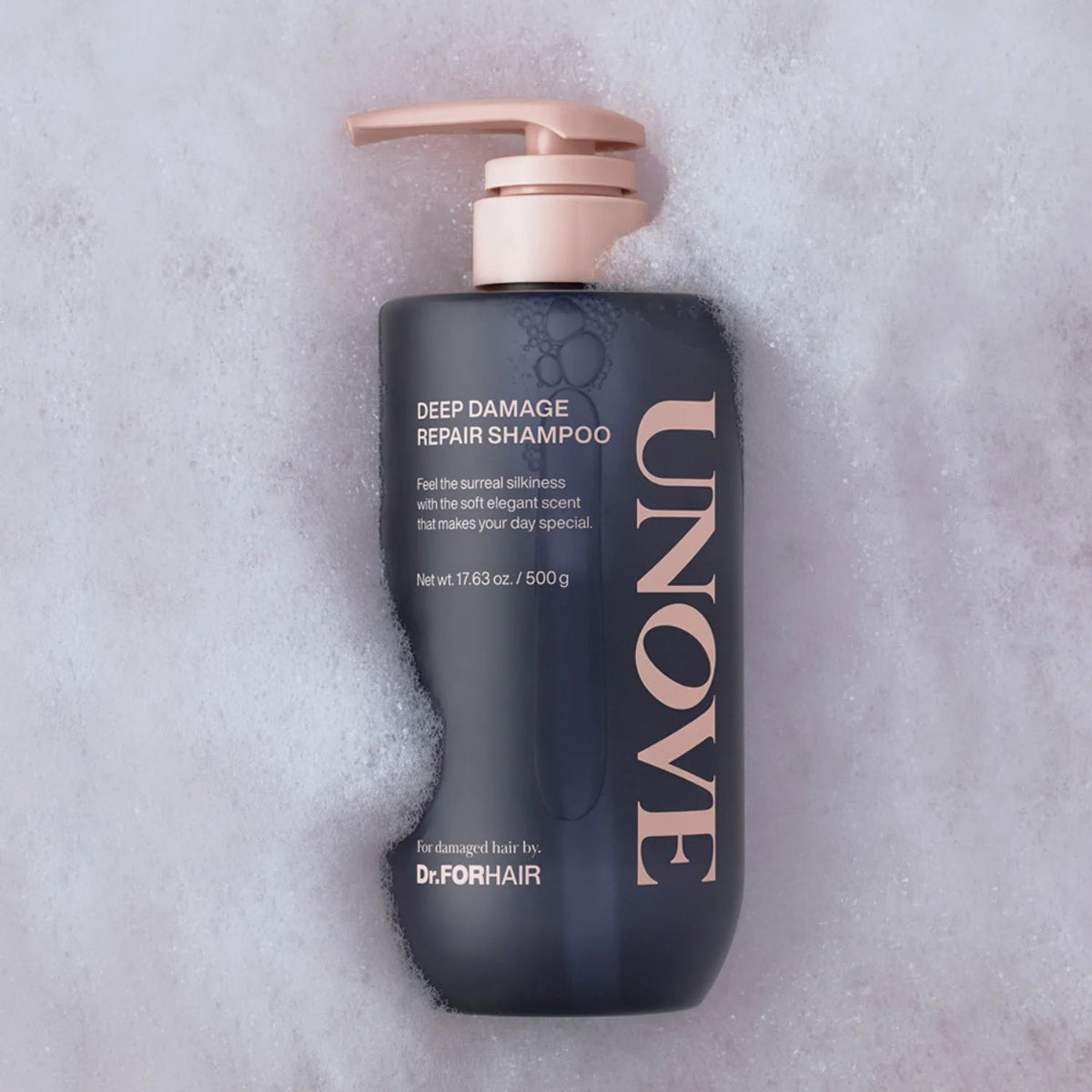 UNOVE deep damage repair shampoo bottle on a textured gray background