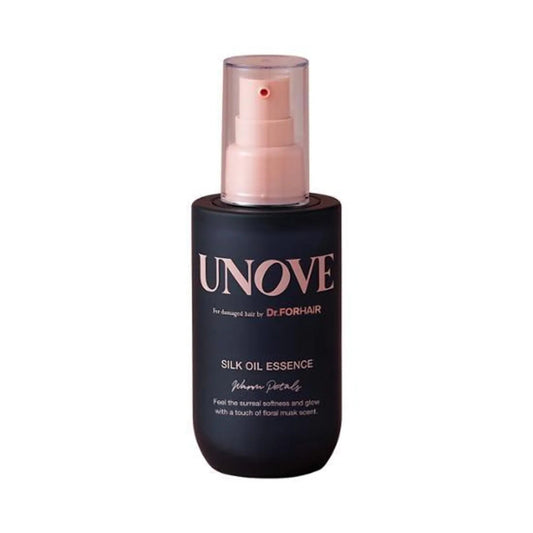 Black bottle of UNOVE Silk Oil Essence with pink pump on a white background